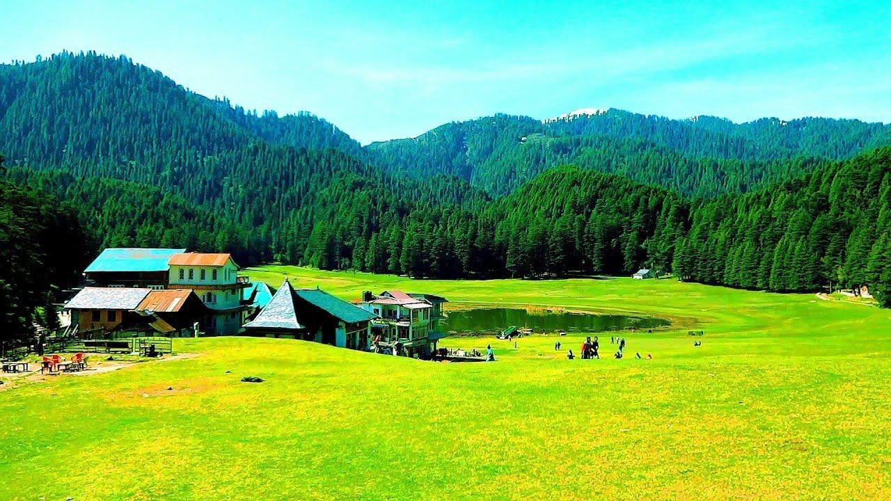 Lush meadows and tranquil lake in Khajjiar, Himachal Pradesh